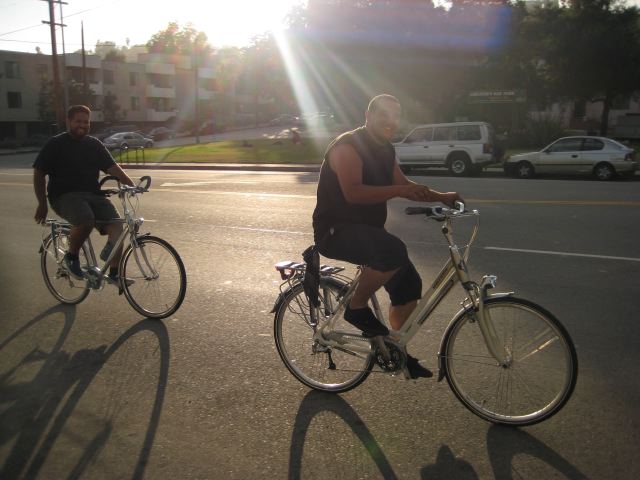 Two regular guys heading home from work on city bikes on North Figueroa Street.