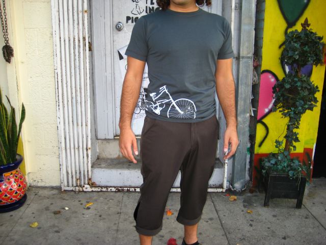 Between  bike shop and a flower vendor, out front of Flying Pigeon LA. T-shirt $30, by J. Knice. Kickers $129, by Bicycle Fixation.