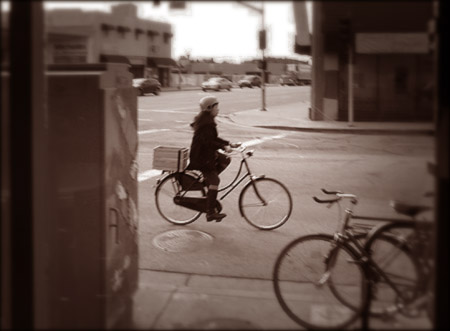 A young woman commuting to work on her bicycle